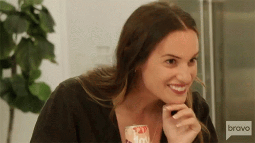 Woman Smiling Holding Soda Can