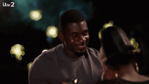 Woman Smiling Holding Wine Glass At ITV2 TV GIF