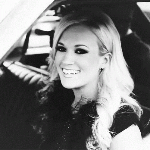 Woman Smiling in Back Seat of Car