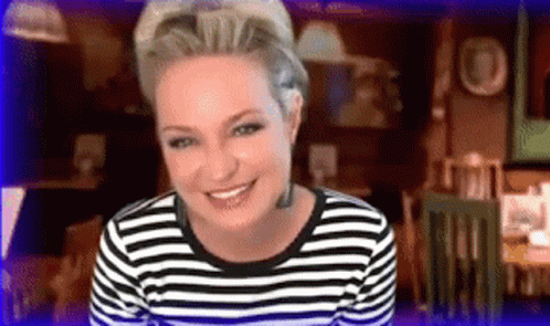 Woman Smiling in Black and White Striped Shirt