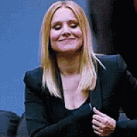 Woman Smiling in Black Jacket and Shirt