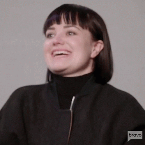 Woman Smiling in Black Jacket and Turtleneck