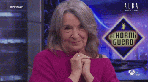 Woman Smiling In Front Of Alba Logo