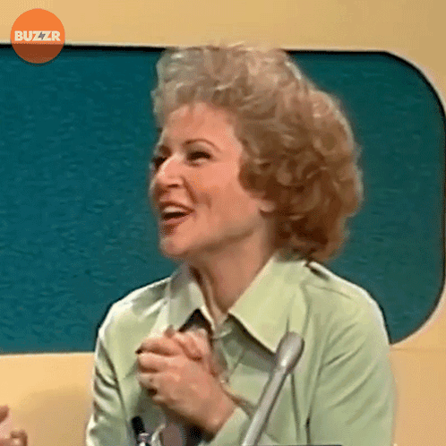 Woman Smiling In Front Of Microphone Buzzr GIF