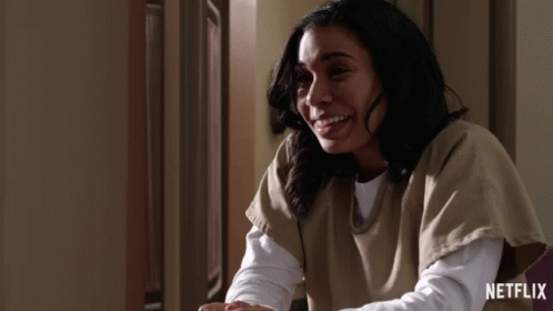 Woman Smiling in Front of Netflix Ad