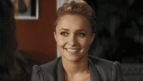 Woman Smiling In Front Of Striped Background GIF
