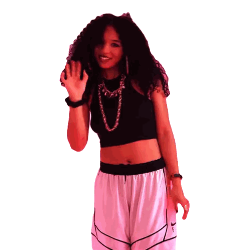 Woman Smiling in Nike Shorts and Black Crop Top