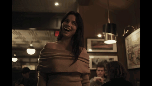 Woman Smiling in Off Shoulder Sweater