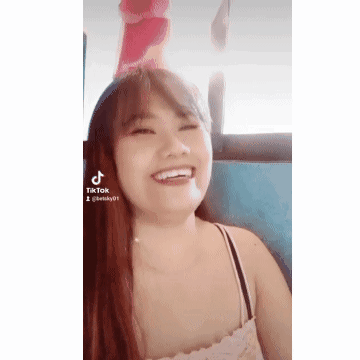 Woman Smiling in Pink Hat