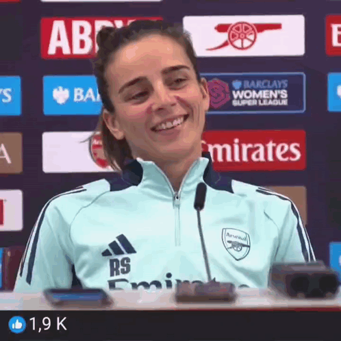 Woman Smiling in Soccer Jersey