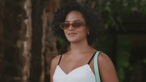 Woman Smiling in Sunglasses and White Top