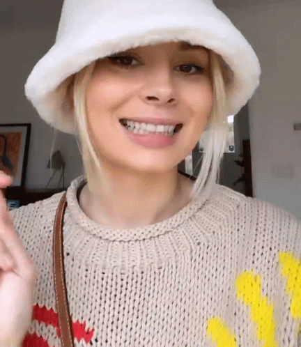 Woman Smiling In Sweater And White Hat GIF
