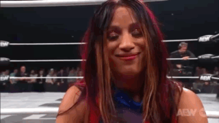Woman Smiling in Wrestling Ring