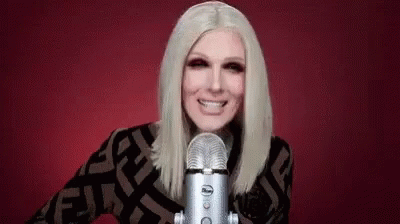 Woman Smiling Into Microphone GIF