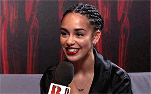 Woman Smiling Into Microphone Saying R