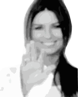 Woman Smiling Making Peace Sign