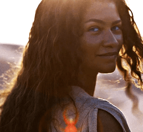 Woman Smiling Over Shoulder With Long Hair