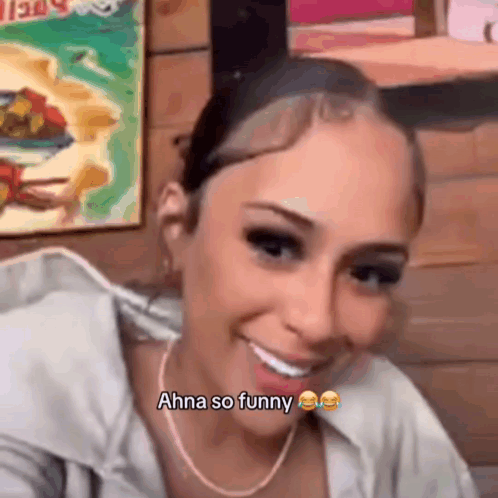 Woman Smiling Saying Ahna So Funny With Necklace