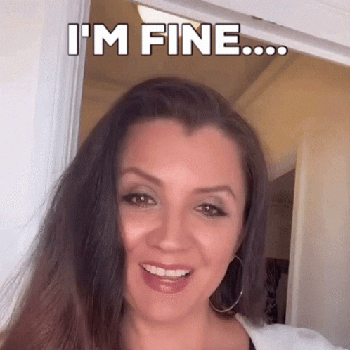 Woman Smiling Saying I'm Fine in Doorway