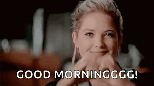 Woman Smiling Thumbs Up Saying Good Morning