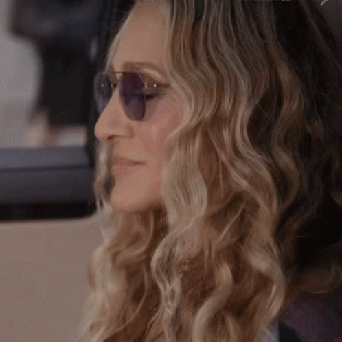 Woman Smiling Wearing Sunglasses