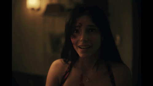 Woman Smiling With Blood on Face