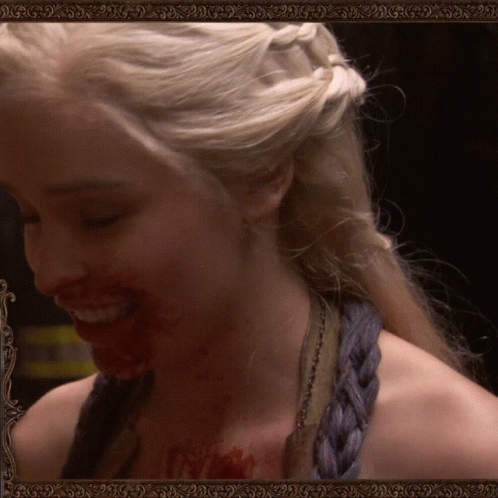 Woman Smiling With Blood on Face