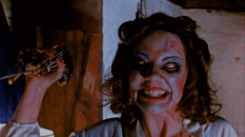 Woman Smiling With Blood on Face