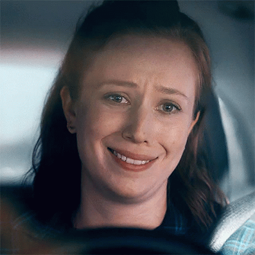 Woman Smiling With Eyes Closed In Car GIF