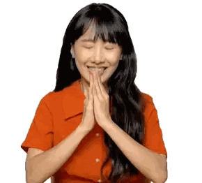 Woman Smiling with Eyes Closed in Orange Shirt
