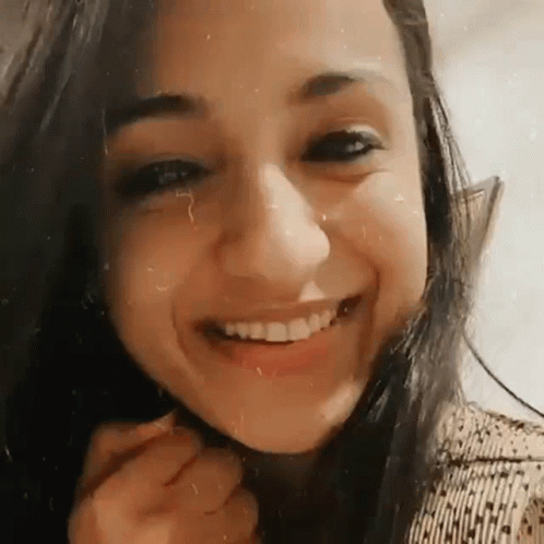 Woman Smiling with Hand on Chin