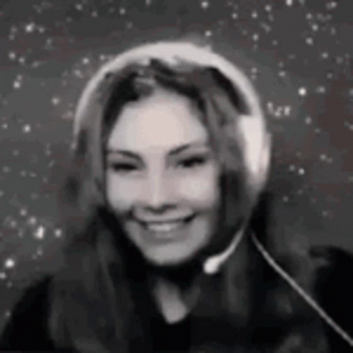 Woman Smiling With Headphones and Microphone