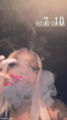 Woman Smoking Cigarette Clock 7:10 PM GIF