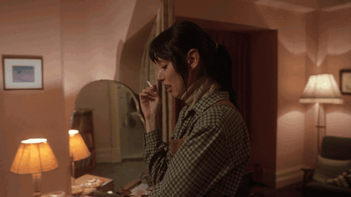 Woman Smoking Cigarette in Mirror