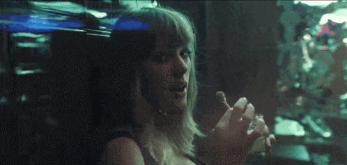 Woman Smoking Cigarette Looking Out Dark Window GIF