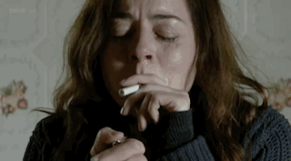 Woman Smoking Cigarette With Eyes Closed GIF