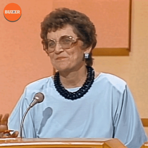 Woman Speaking Into Microphone With Buzzr GIF