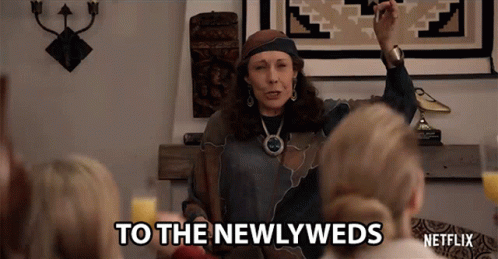 Woman Speaking to Newlyweds