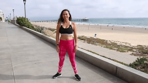 Woman Squats Near Beach GIF