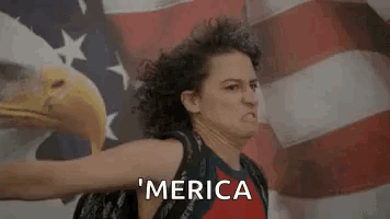 Woman Standing Before American Flag With Bald Eagle GIF
