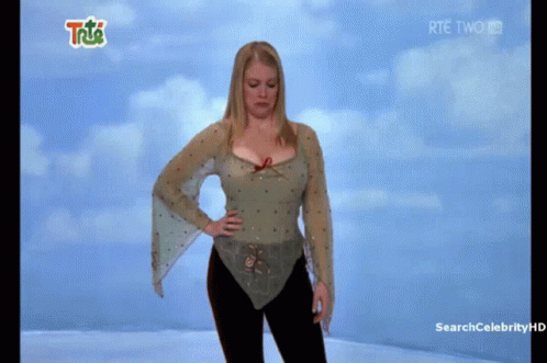Woman Standing Before RTE Two Screen GIF