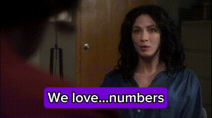 Woman Standing Before We Love Numbers Sign