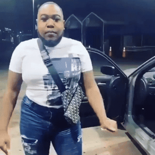 Woman Standing by Car with Open Door