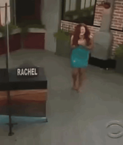 Woman Standing by Rachel Sign