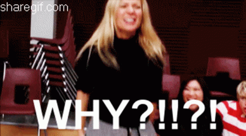 Woman Standing By Stack Of Chairs Saying Why GIF