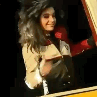 Woman Standing In Car Looking Out GIF