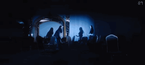 Woman Standing In Dark Room GIF