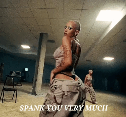 Woman Standing In Dark Room Spank You Very Much GIF