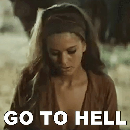 Woman Standing in Dirt with Go to Hell on Face