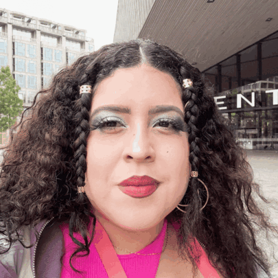 Woman Standing in Front of Building Saying Ent